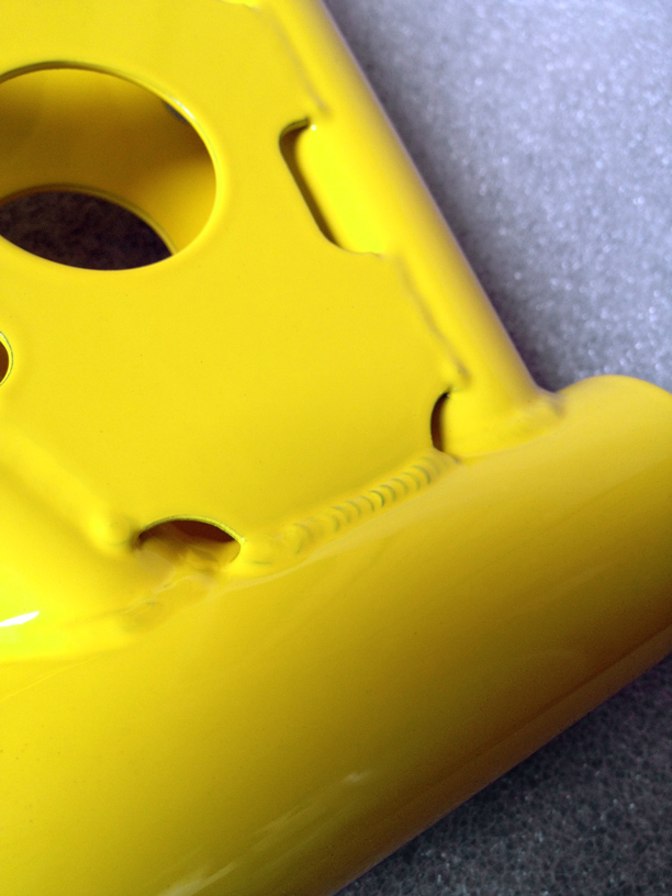 1979 Koizumi Madison Taipan — Super Yellow gloss powder coat, gusset tig welds detail