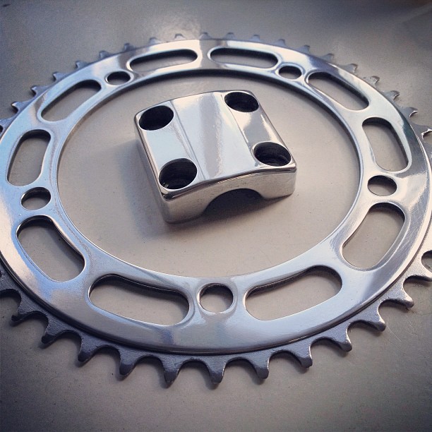 Takagi chainring and stem cap after stripping and buffing before reanodising